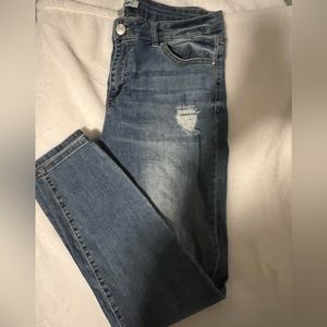 Blue distressed denim skinny jeans